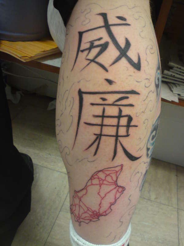 Part of full leg tattoo