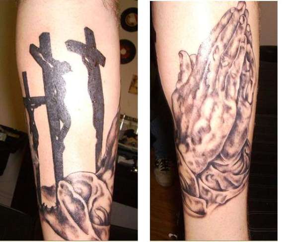 Cross and hands tattoo