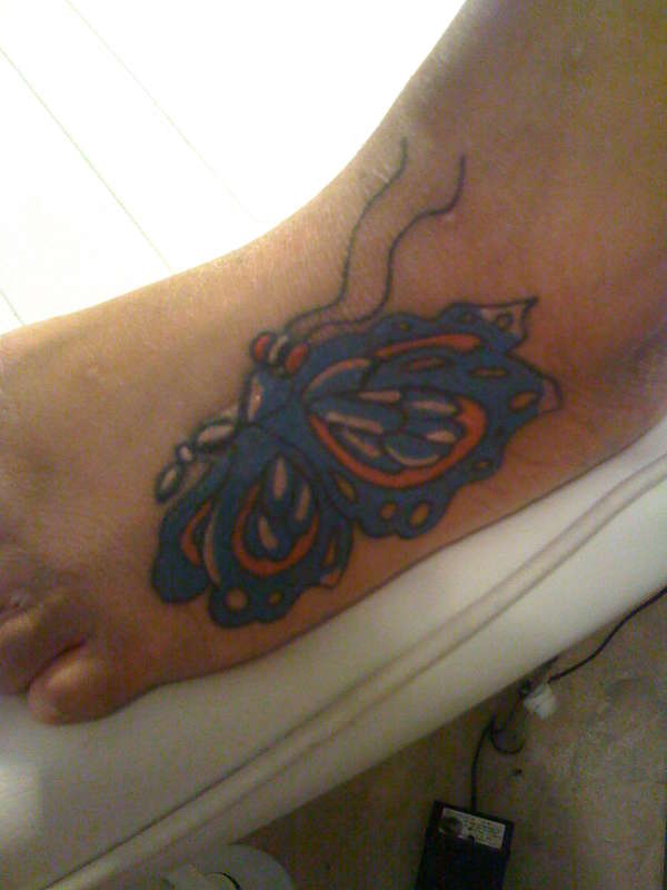 MY WIFES BUTTER FLY tattoo