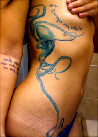 Octopus and Latin quotes tattoo