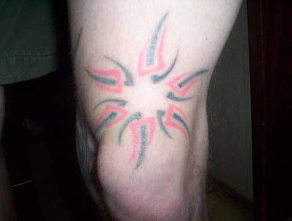 tribal sun tattoo