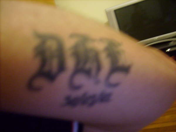 initails arm tattoo