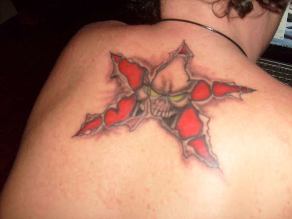 torn star skull tattoo