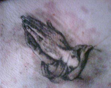Praying tattoo