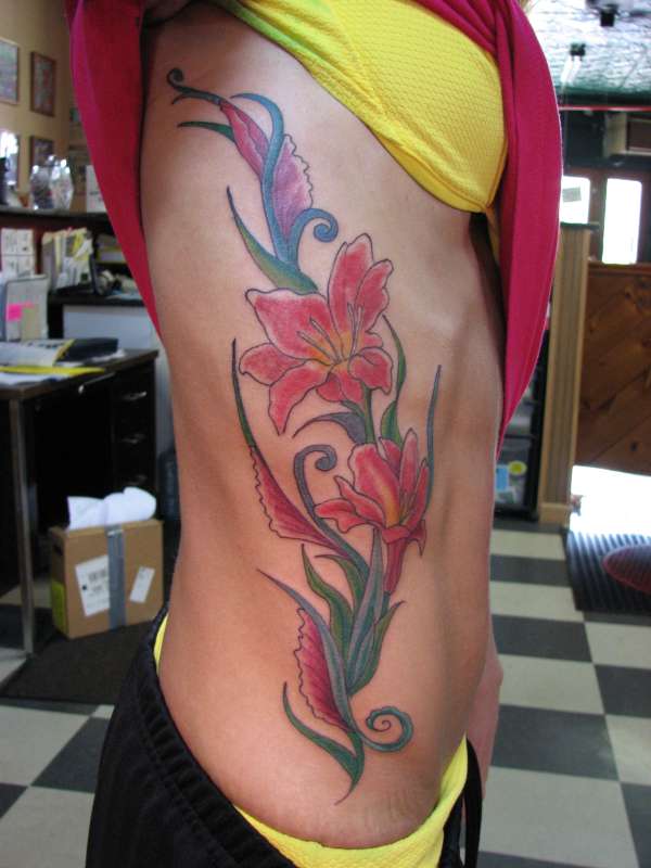 side lillies tattoo