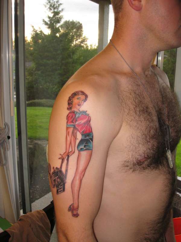 pin-up girl with camera tattoo