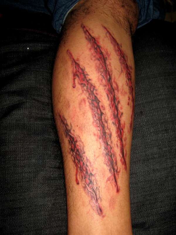 wounded skin tattoo