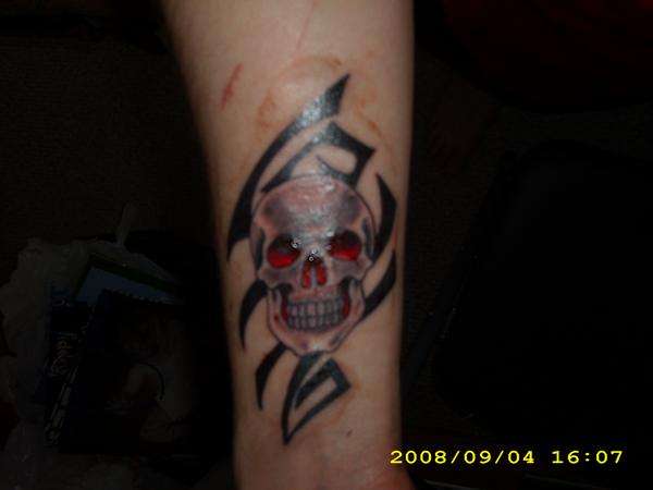 Skull n tribal tattoo