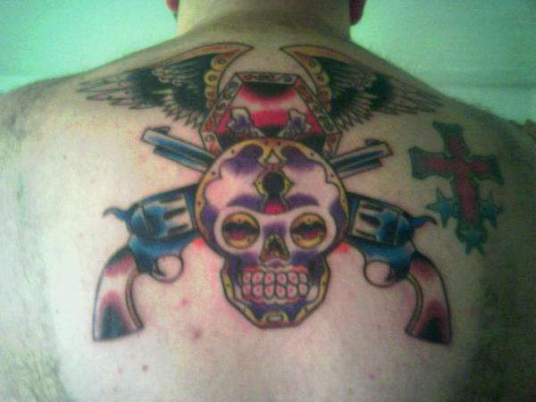 skull and guns tattoo
