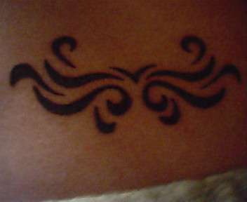 "On my lower back" tattoo