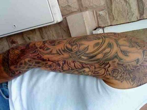 sepia sleeve work tattoo