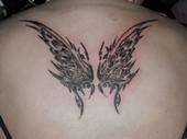 butterfly on my girls back tattoo