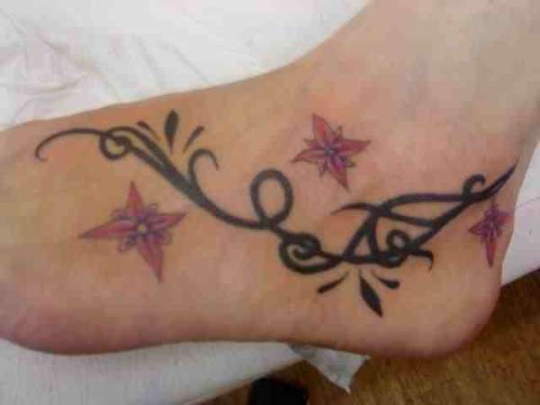 FOOT TRIBAL AND FLOWERS tattoo
