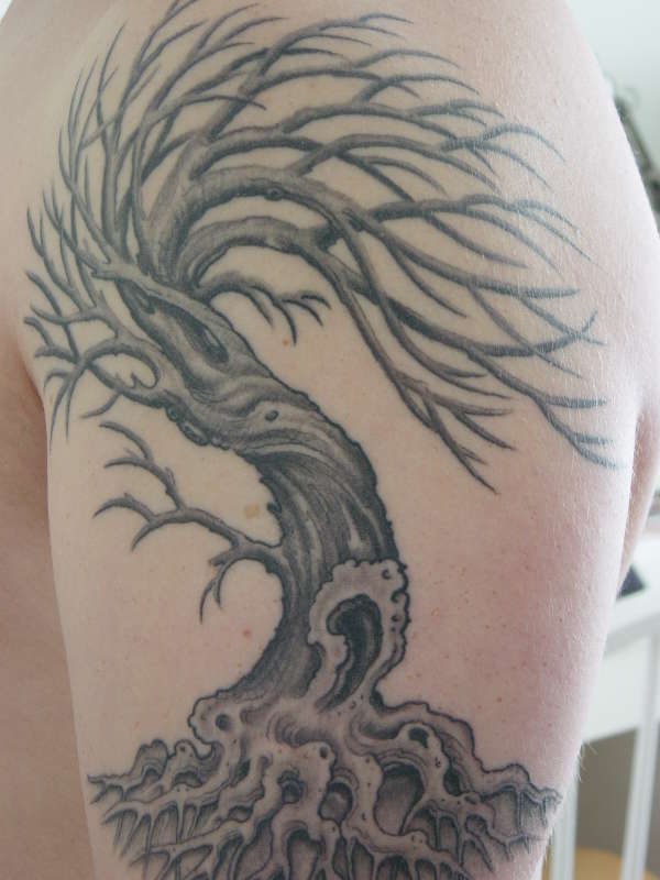 Windswept tree tattoo