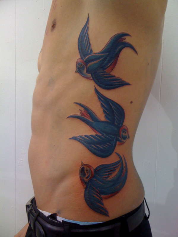 Bluebird rib piece tattoo