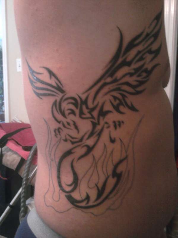 phoenix on ribcage tattoo phoenix on ribcage tattoo