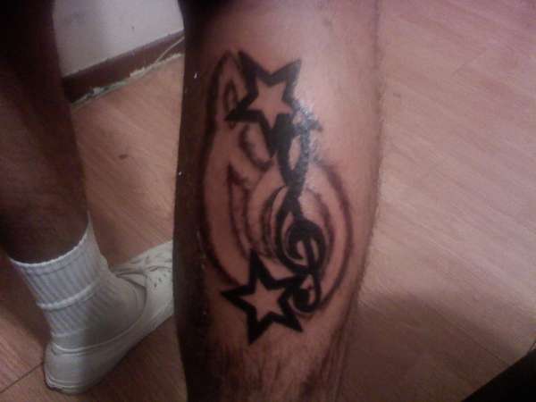 Music note with 2 stars and shaded outline of a bigger note tattoo