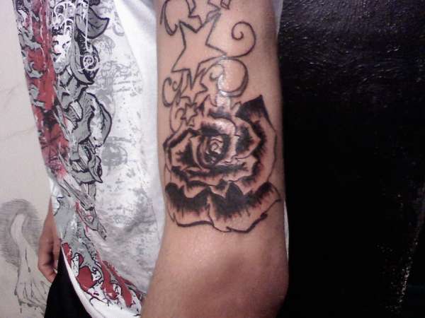 Rose on my brothers arm tattoo