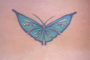 Butterfly on lower back tattoo