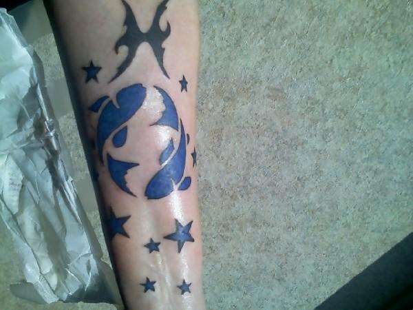 Pisces from Mom and Dad tattoo