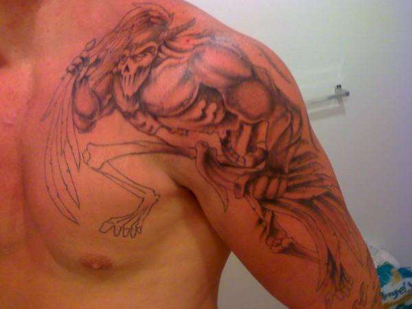left arm demon tat tattoo