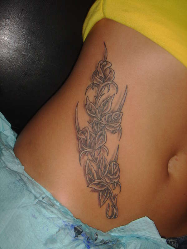 roses on hip tattoo