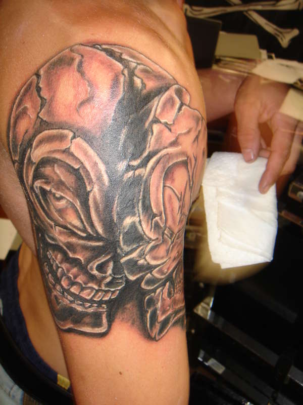 two faceskull tattoo