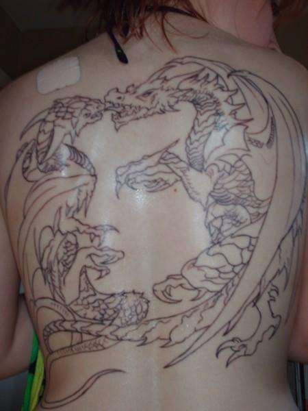 Dancing Dragons or woman's face? tattoo