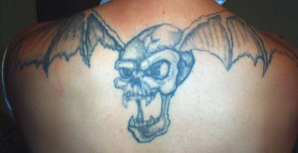 skull and wings tattoo