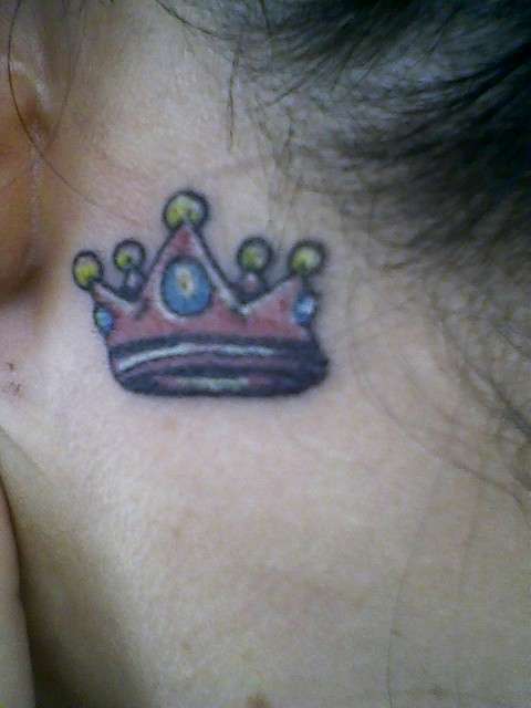 Pink crown tattoo