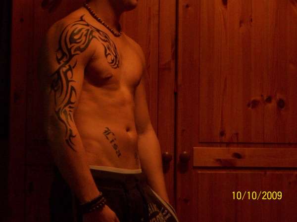 tribal arm/chest tattoo