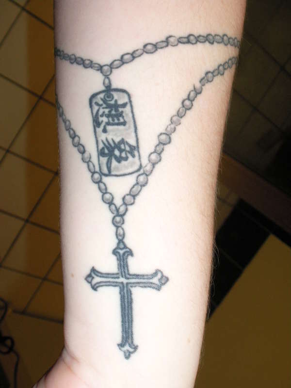 beads, dogtag and cross tattoo