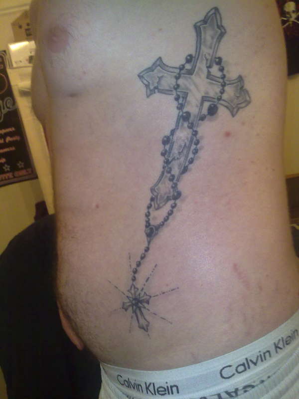 Cross and roseary tattoo