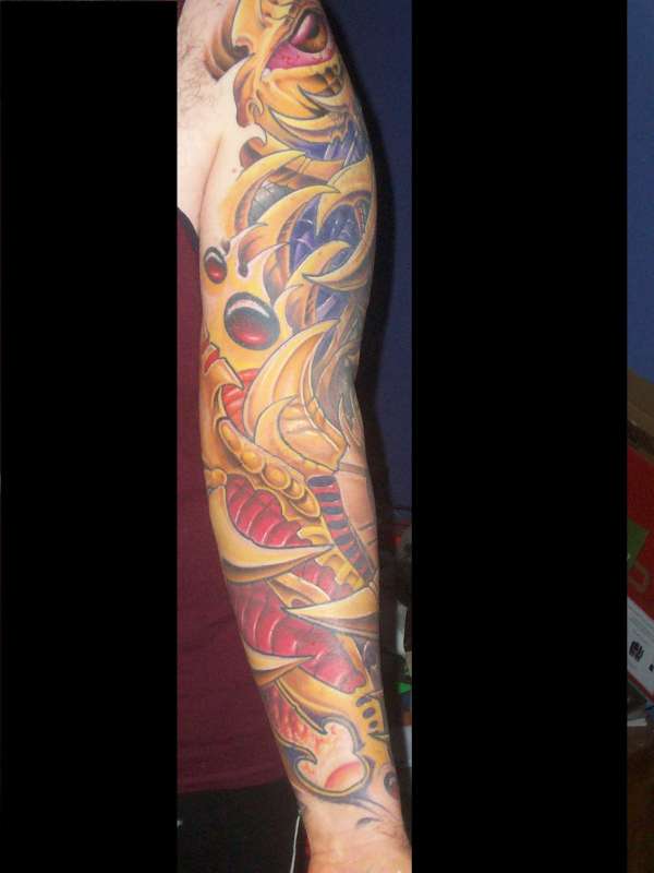 almost finished bio mech sleeve tattoo