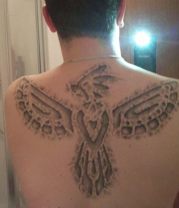 phoenix in stone tattoo