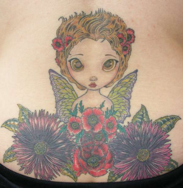 Lower back cover-up tattoo