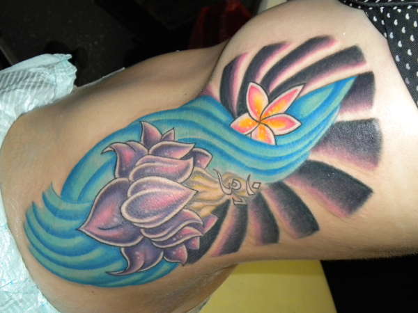 Lotus and Om tattoo
