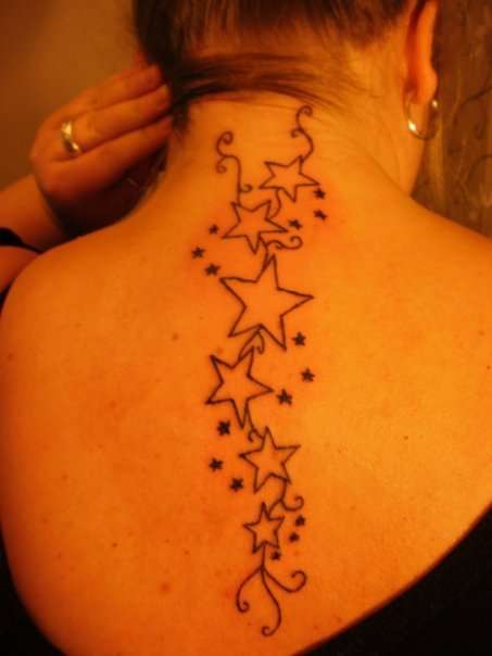 Stars on back tattoo