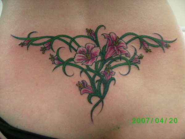 flowers lower back tattoo