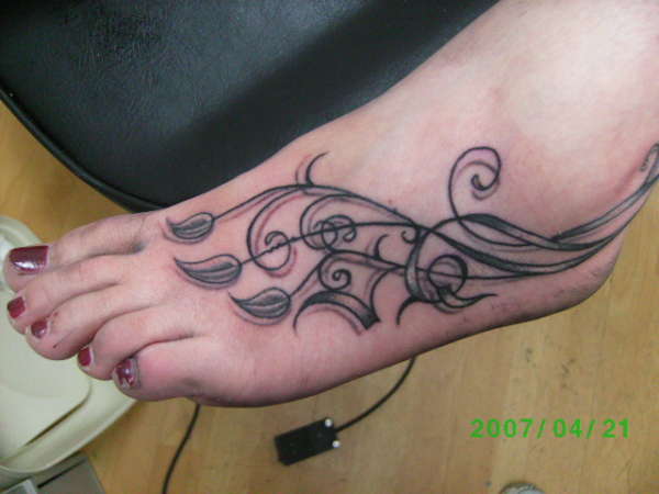 freehand vines on foot tattoo