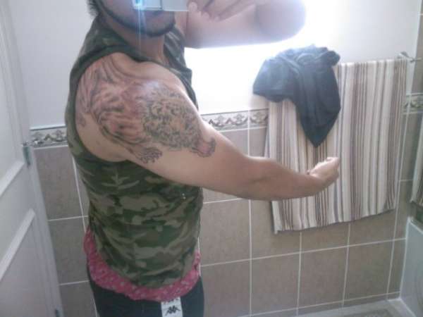 Pre pouncing lion tattoo