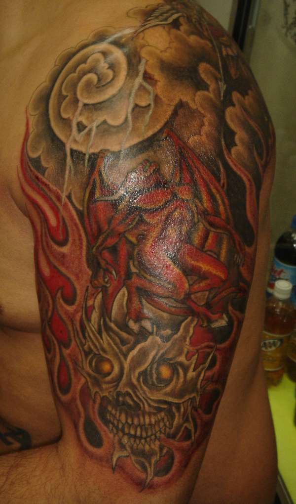 skull clouds tattoo