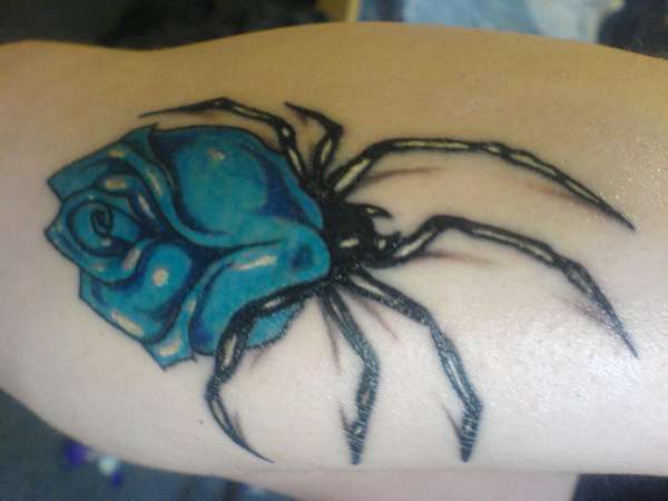 another spider rose but in blue tattoo