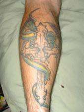 dragon on cross tattoo