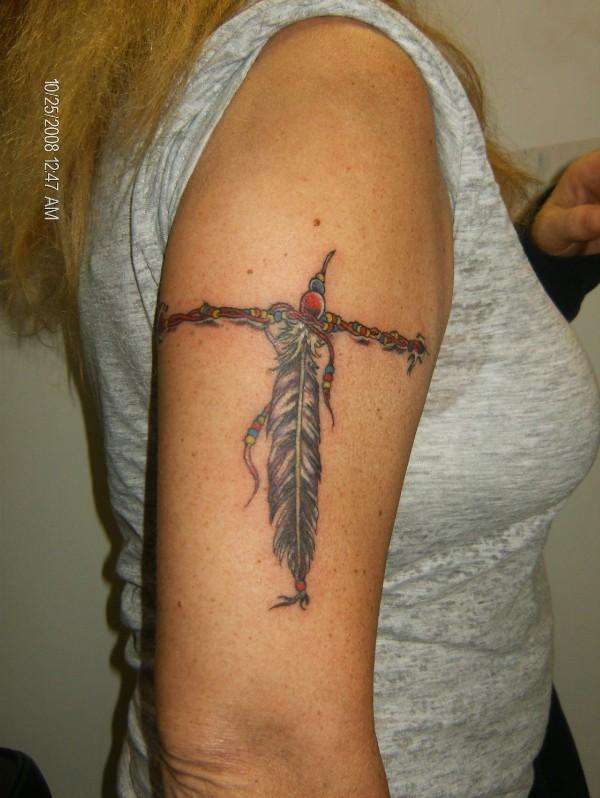 Feather band tattoo