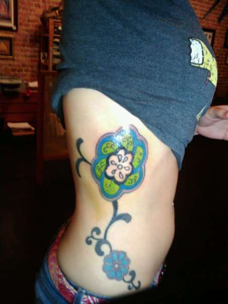 Rib Flowers tattoo