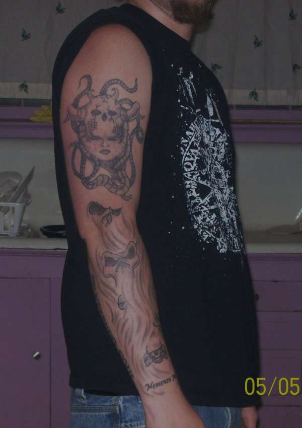 working on right full sleeve tattoo