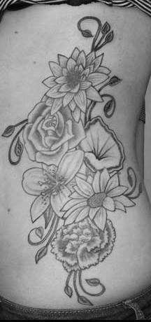 Flowers on ribs tattoo
