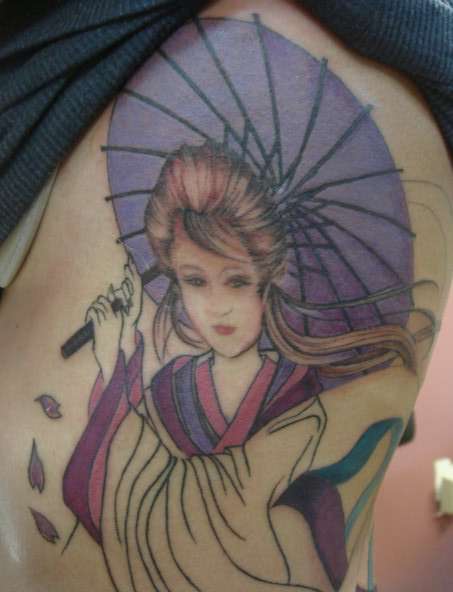 Geisha on ribs- close up tattoo