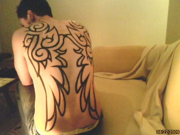 Tribal wings tattoo